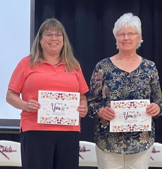 Arcadia employees, Lori Bush and Elaine VanSlyke, volunteer with the elementary reading program.